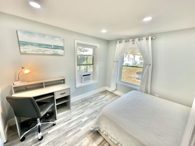 Bedroom has desk and large closet